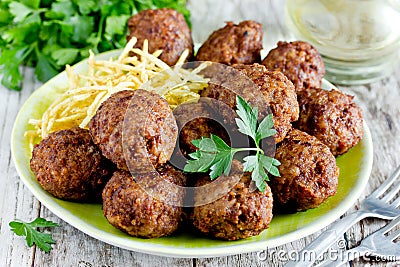 Turkish meatballs kuru kofte garnished with fried potato Stock Photo