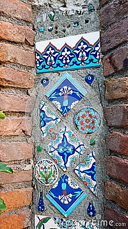 Turkish ornament on ceramic tile in wall. Decorative ornamental design in Turkey. Editorial Stock Photo