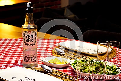 Turkish raki and roasted bonito fish on the table Editorial Stock Photo