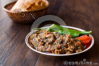Turkish Street Food Kokorec with Tomato and Green Pepper. Portion Sheep Bowel. Stock Photo