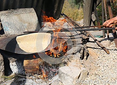 Turkish Style Tortilla cooking on the fire Stock Photo