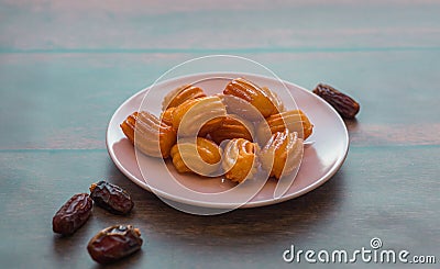 Turkish Tulumba sweets and dates Stock Photo