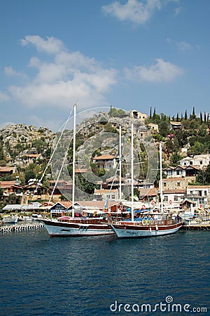 Turkish village on the rocks at Mediterranean sea shore Editorial Stock Photo
