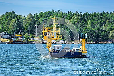 Yellow cable ferry carrying summer habitants and tourists to archipelago from Nauvo to Korppoo island, Finland Editorial Stock Photo