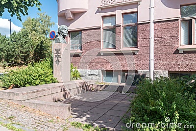 Square with Vladimir Lenin bust next to visited house by Vladimir Ilyich Ulyanov in 1907 during his escape from Tsarist Russia Editorial Stock Photo