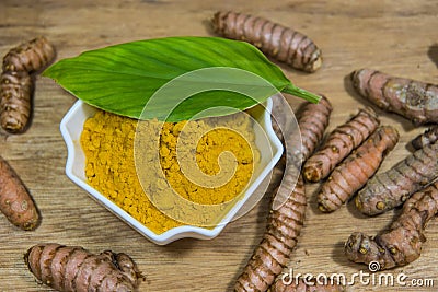 Turmeric, leaf, roots and powder Stock Photo
