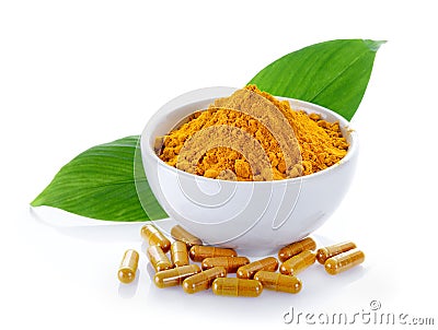 Turmeric powder and turmeric capsules on white background Stock Photo