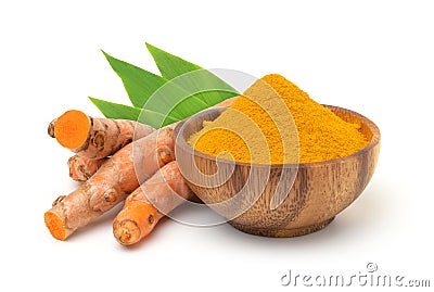 Turmeric powder in a wooden bowl and turmeric (curcumin) rhizomes isolated on a white background. Stock Photo