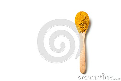 A turmeric powder in a wooden spoon. Stock Photo