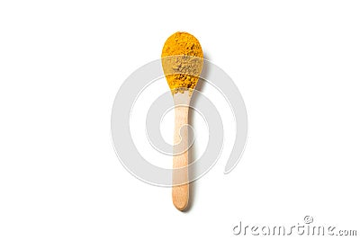 A turmeric powder in a wooden spoon. Stock Photo