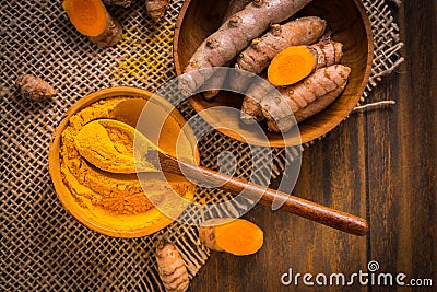 Turmeric root and powder Curcuma longa as cooking ingredient Stock Photo