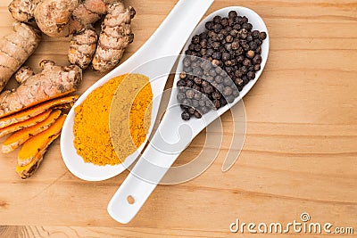 Turmeric roots and black pepper combination enhances curcumin ab Stock Photo