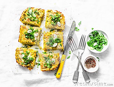 Turmeric, zucchini, mashed chickpeas tortilla with herbs on a light background, top view. Delicious appetizers Stock Photo