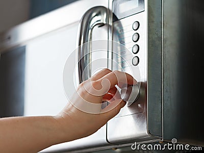 Turn on microwave oven Stock Photo