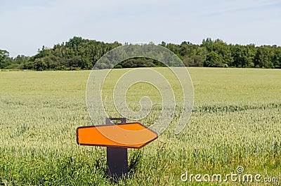 Turn right road sign in a farmers field Stock Photo