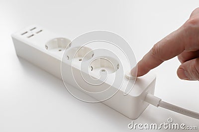 turn on. a versatile modern white extension cord with sockets and usb ports Stock Photo