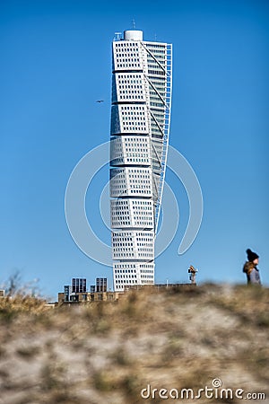 Turning Torso with a blurred person. Skyscraper with a contemporary facade bears a modern lifestyle and futuristic architecture Editorial Stock Photo