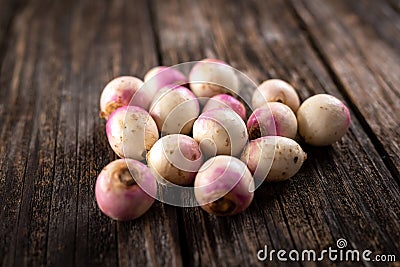 Turnips, beets on rustic wooden background Stock Photo
