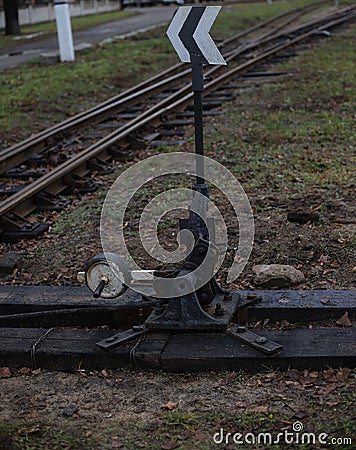 turnout railroad tracks of the old model near grass and earth. for introductory instructions books Stock Photo