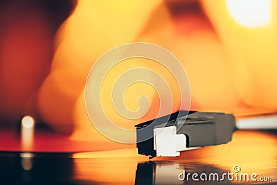 Turntable with LP vinyl record against burning fire Stock Photo