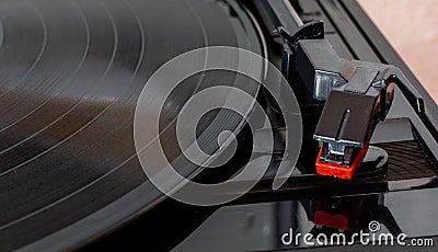 Turntable with vinyl record. Musical equipment. Electronic devices. Nostalgic music equipment. Stock Photo