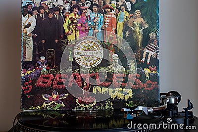 Turntables with the Beatles vinyls in the background. Editorial Stock Photo