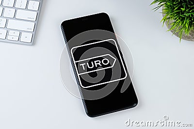 Turo app logo on a smartphone screen Editorial Stock Photo