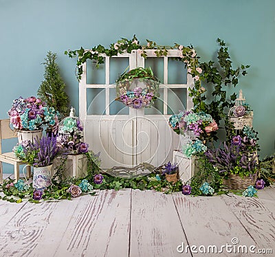 Turqoise spring sett up with colourful flowers pink , purple, bleu, and turqoise flowers, vintage wood parquet Stock Photo
