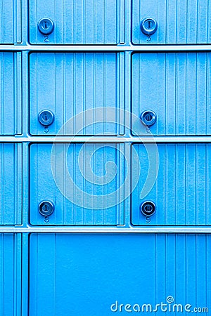 Turquoise blue mailbox with numbered keyholes Stock Photo