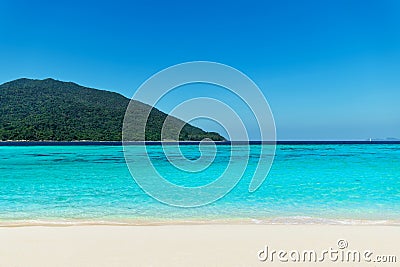 Turquoise clear sea and white sand beach on tropical island Stock Photo