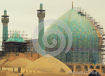 Turquoise dome Isfahan mosque and maintenance scaffolds Stock Photo