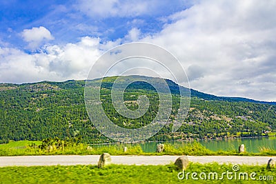 Turquoise green water of fjord river mountains landscape of Norway Stock Photo