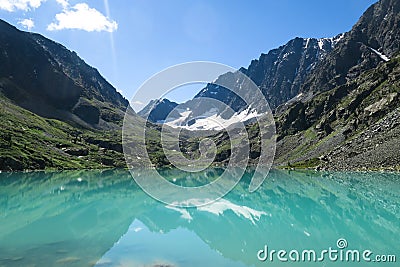 Turquoise Kuyguk lake. Picturesque blue mountain lake. Altai mountains, Siberia, Russia Stock Photo