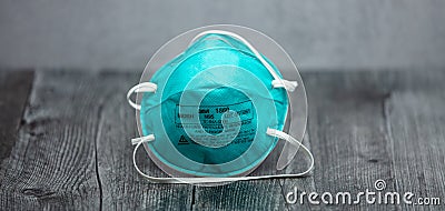 Turquoise 3M N95 Respirator Mask on Wooden Table Editorial Stock Photo