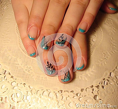 Turquoise manicure with a pattern. Stock Photo