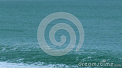Turquoise Ocean Boiling With Foamy Waves. Sea Waves Crashing. Real time. Stock Photo
