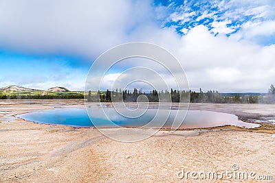 Turquoise Pool under beautiful sky in Yellowstone National Park Stock Photo