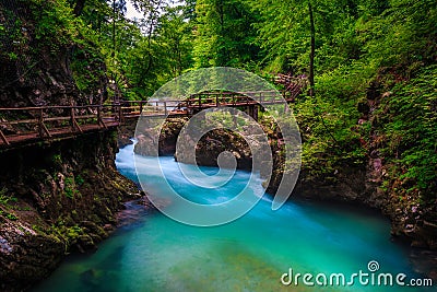 Turquoise Radovna river in Vintgar gorge and wooden footbridge, Slovenia Stock Photo