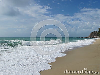 Turquoise sea and blue sky. There are beautiful clouds in the sky Stock Photo