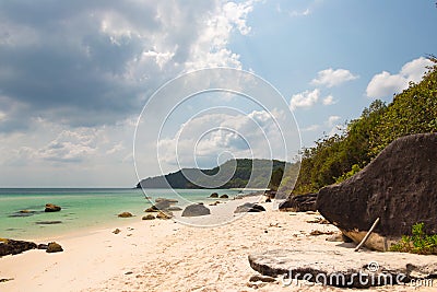 Turquoise sea, white sand and stones Stock Photo