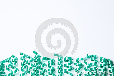 Turquoise serpentine streamers on white background, top view Stock Photo