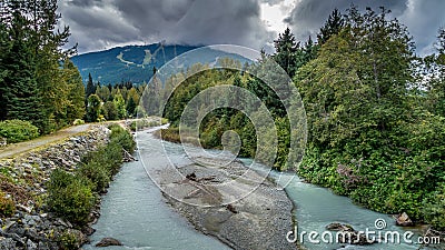 The Turquoise Waters of Fitzsimmons Creek at the Village of Whistler Stock Photo