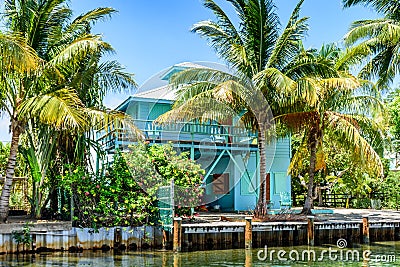 Turquoise waterside house, Placencia, Belize, Editorial Stock Photo