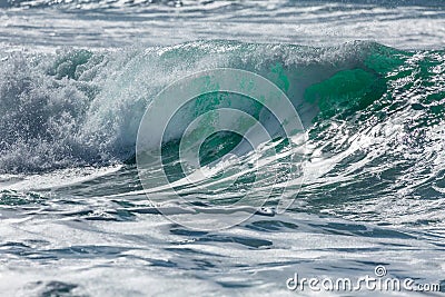 Turquoise Wave breaking on the North Cornwall Coastline Stock Photo