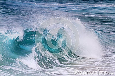 Turquoise wave is illuminated from the middle Stock Photo