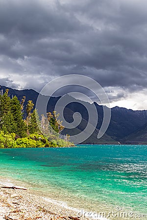 Turquoise wave running onto the sandy shore. South Island, New Zealand Stock Photo