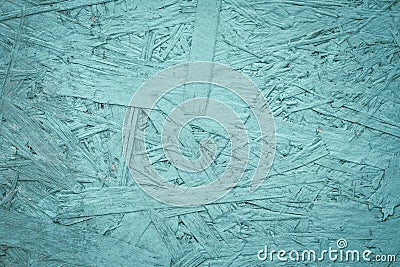 Turquoise wood texture. Wooden green background. Oriented strand board of aqua color. Light filings, plywood slab surface. Stock Photo
