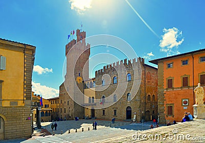 TUSCANY, AREZZO. tourists on the stairs in front of medieval San Pietro and Donato historical cathedral with facade of Editorial Stock Photo