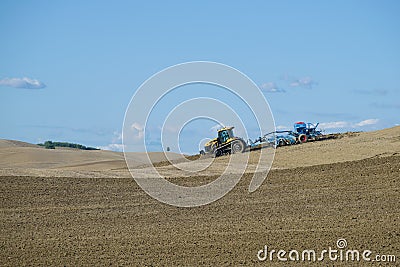 Tracked tractor Challenger MT765D with pneumatic seed drill Lemken Solitair 9 in the field on a sunny Septem Editorial Stock Photo