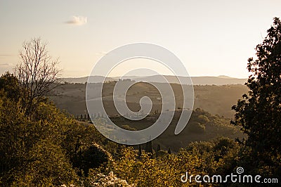 Tuscany landscape in Italy during the sunset with warm colors Stock Photo